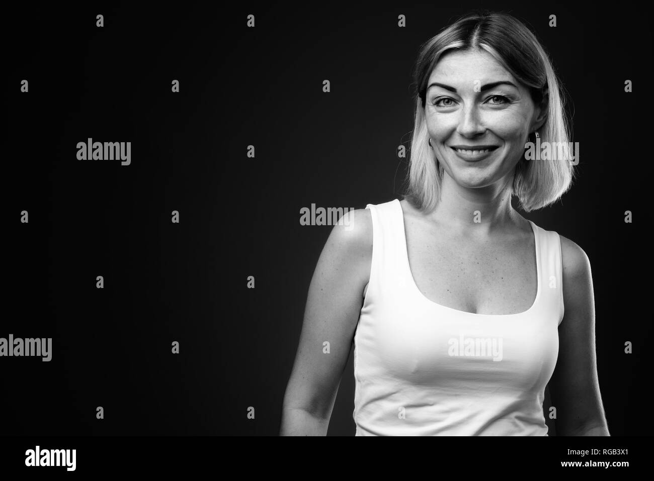 Beautiful businesswoman with short hair in black and white Stock Photo