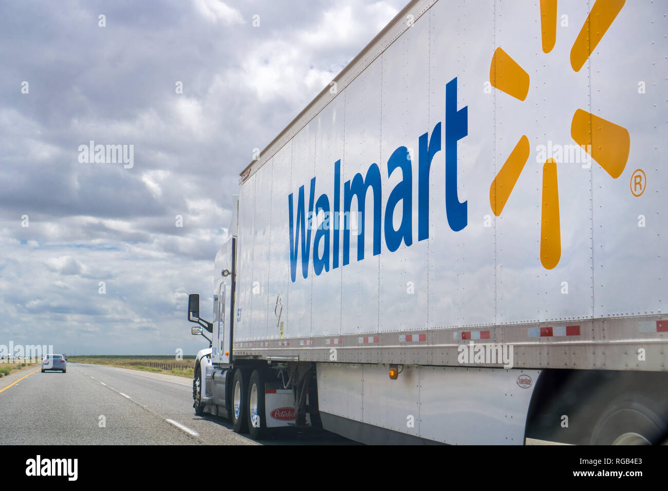 May 25, 2018 Bakersfield / CA / USA - Walmart truck driving on the interstate on a cloudy day Stock Photo