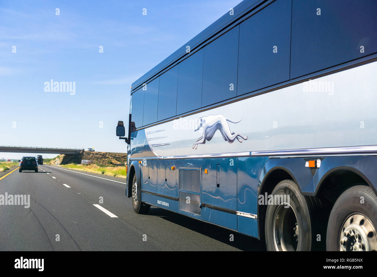June 10, 2018 Los Banos / CA / USA - Greyhound bus driving north on I5 interstate towards San Francisco Stock Photo
