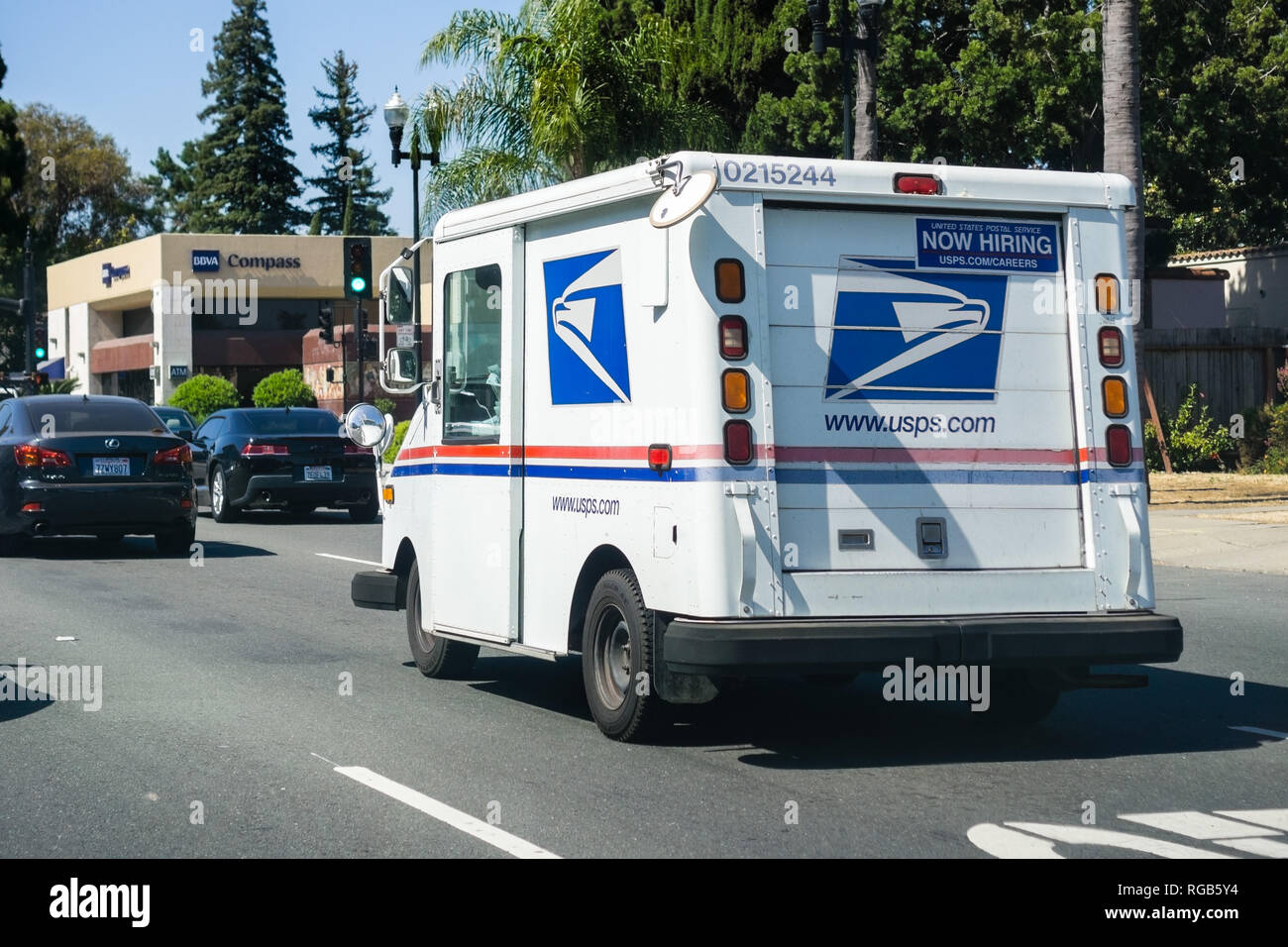 July 5, 2018 Sunnyvale / CA / USA - USPS vehicle driving on a busy street in south San Francisco bay area Stock Photo
