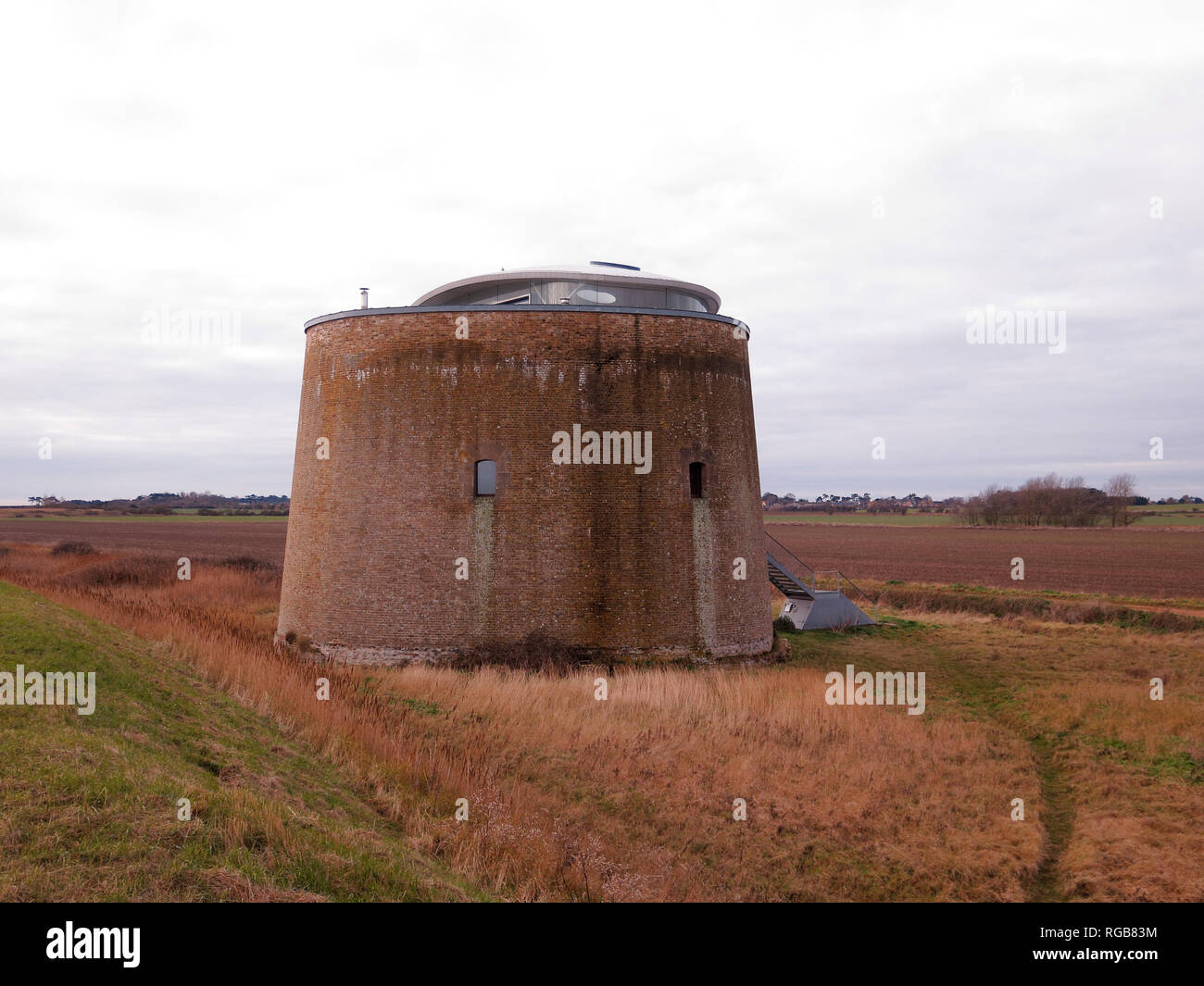 Martello tower near Bawdsey, Suffolk, January 2019  Originally built for coastal defence, this  martello tower has been converted for use as a holiday Stock Photo