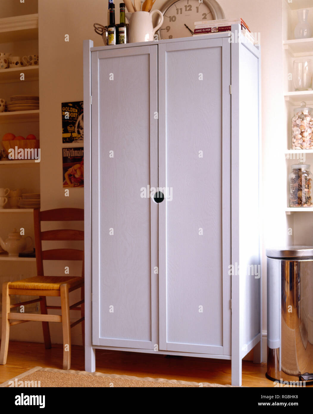 White painted wooden cupboard in kitchen Stock Photo Alamy
