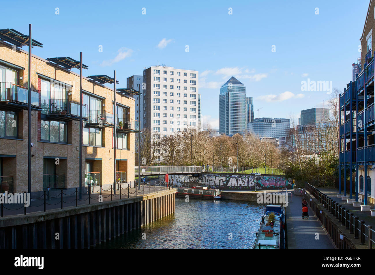 New apartments along Limehouse Cut at Limehouse, East London UK, looking towards Canary Wharf Stock Photo