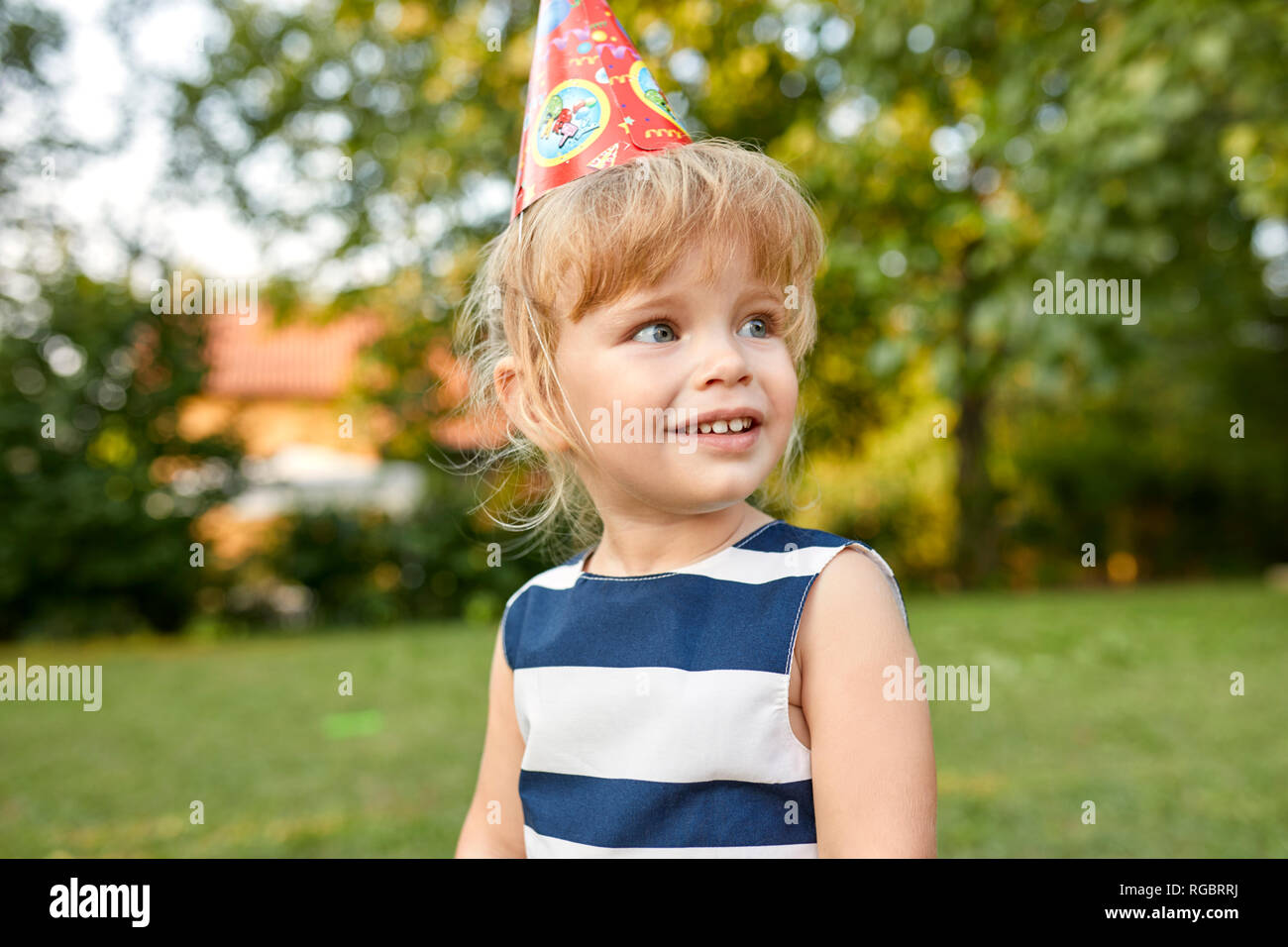 little girl on a birthday garden party 