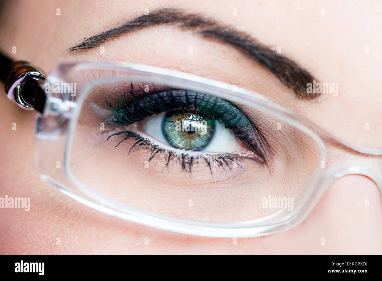 Woman's eye, glasses, close-up Stock Photo
