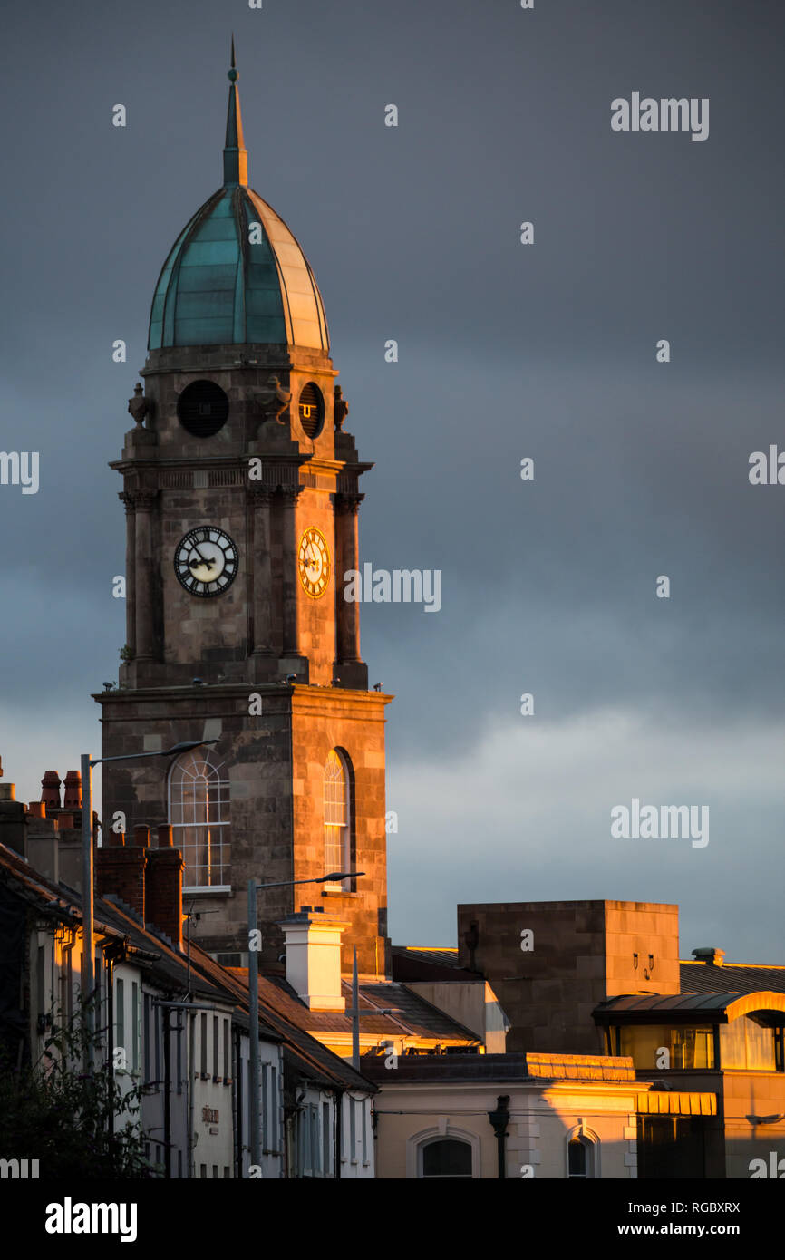 Late evening sunlight shines on the clock tower of the Irish Linen Centre in the centre of Lisburn, N.Ireland. Stock Photo