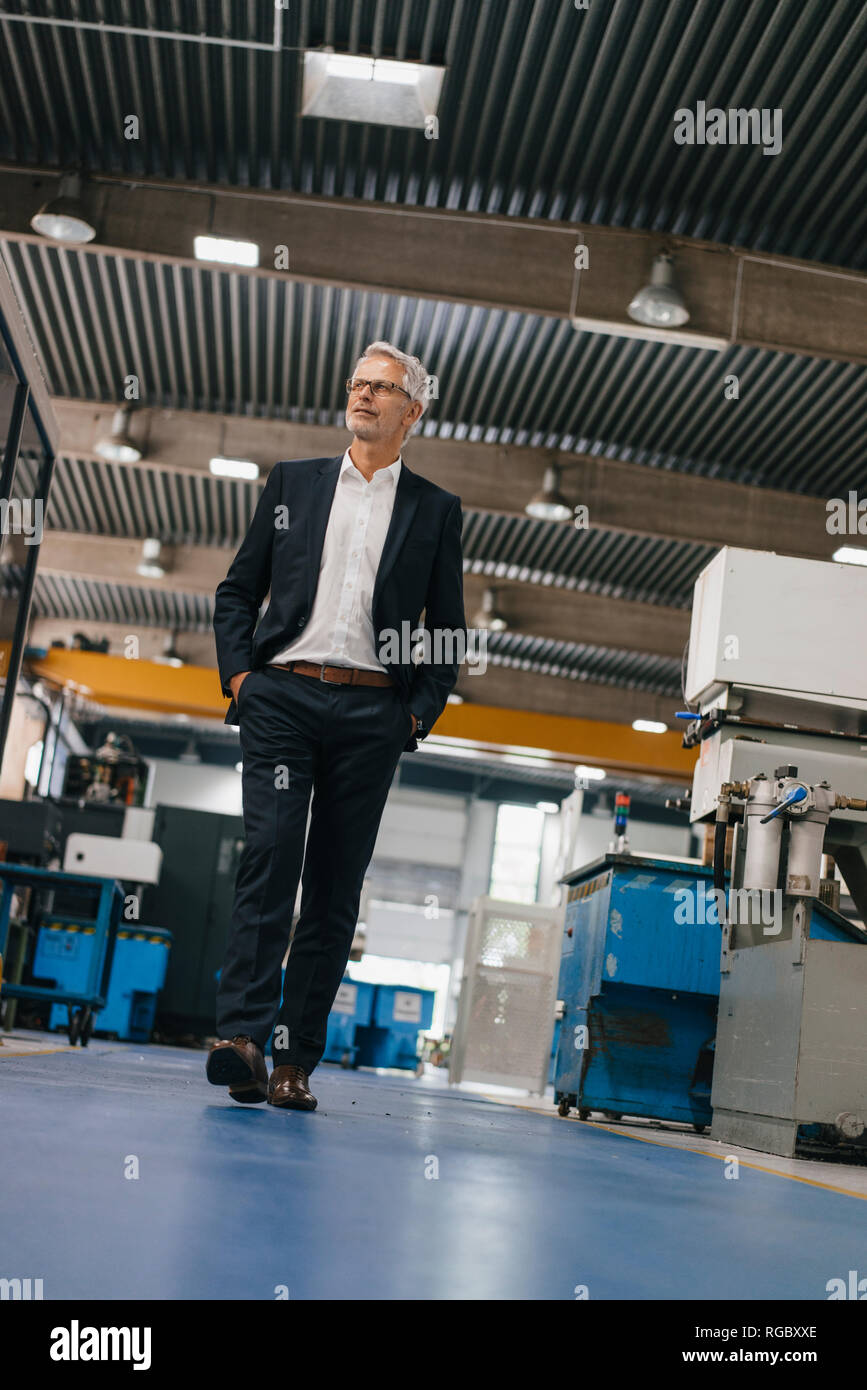 Successful entrepreneur in factory workshop of his company Stock Photo