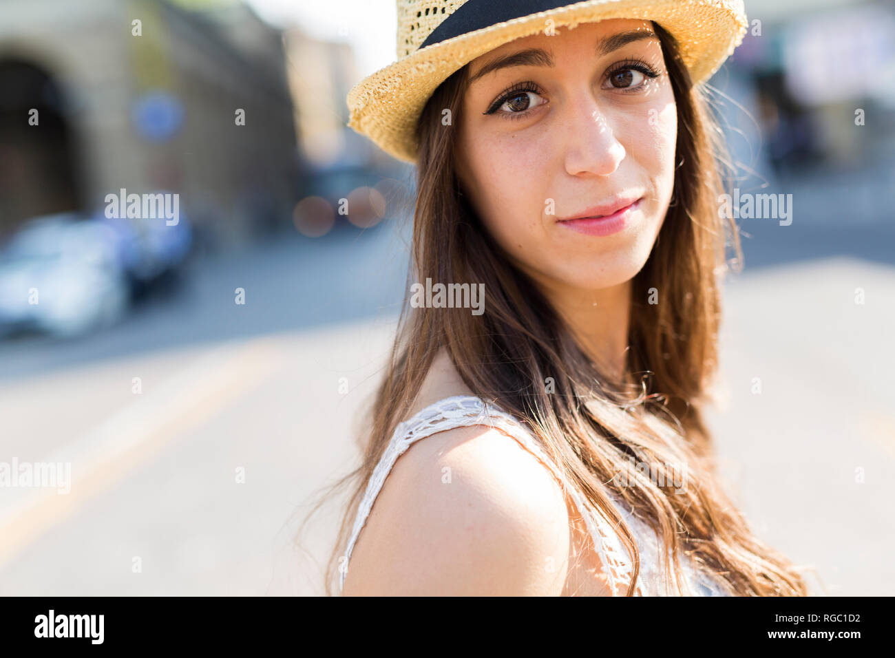 Portrait of young woman wearing straw hat Stock Photo