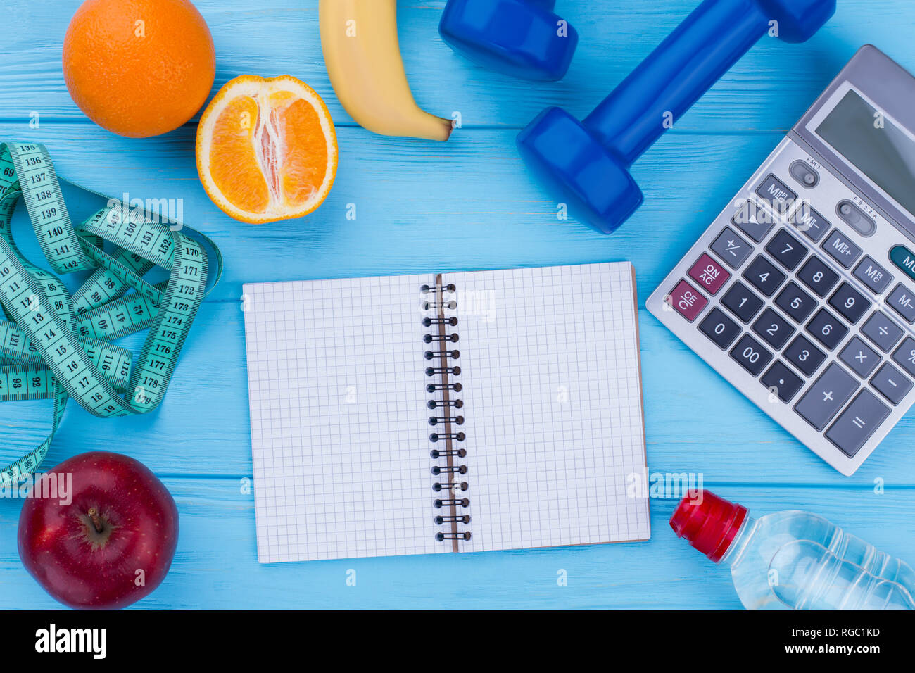 Fruits, fitness equipment, calculator and notepad. Balanced diet, sport and  slimming. Tips to boost your weight loss Stock Photo - Alamy