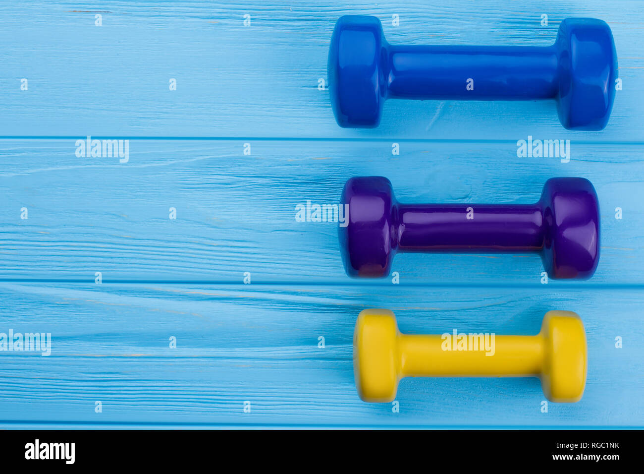 Colorful dumbbells with copy space. Women dumbbell weights, text space ...