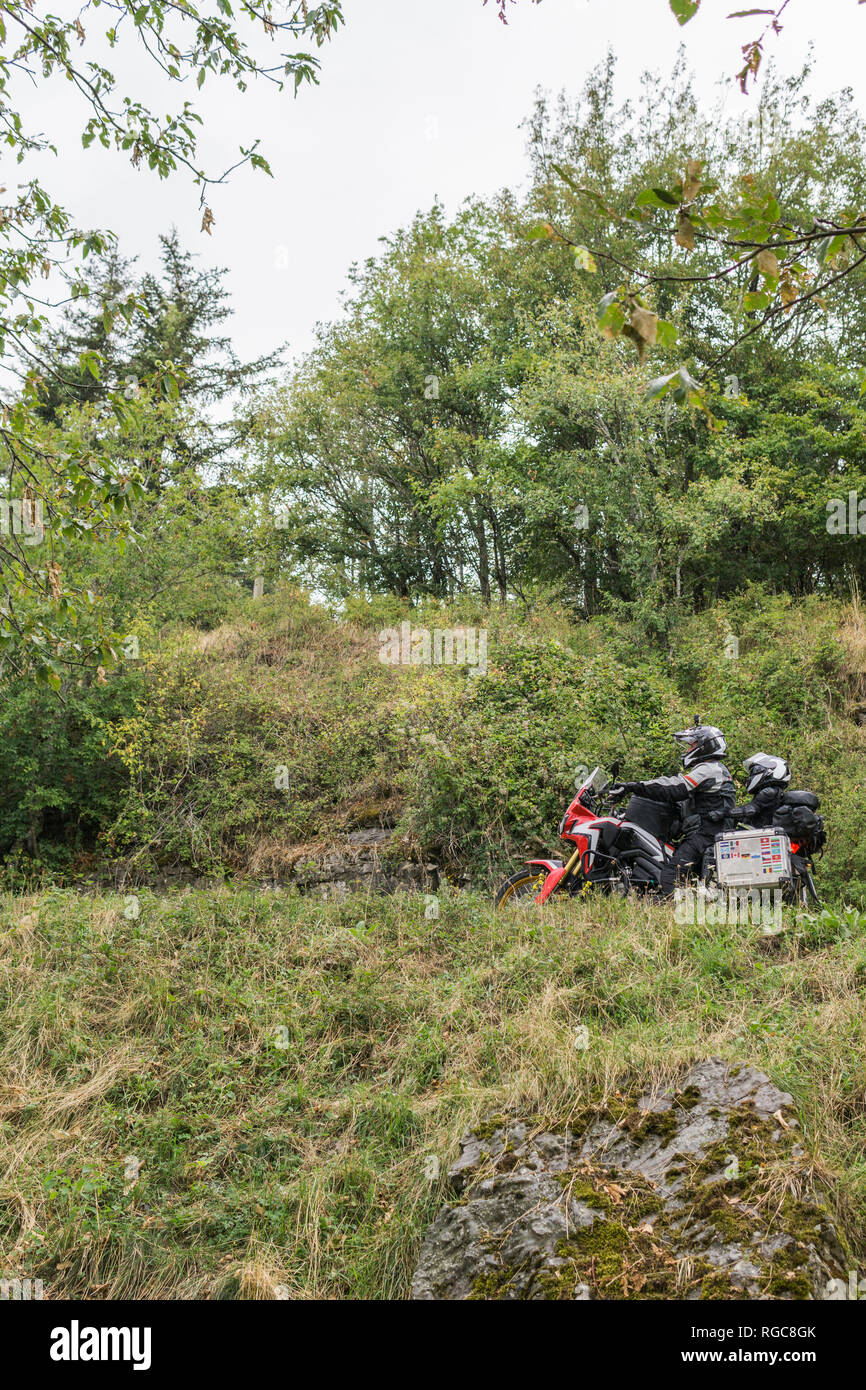 Father and son on a motorbike trip in the countryside Stock Photo