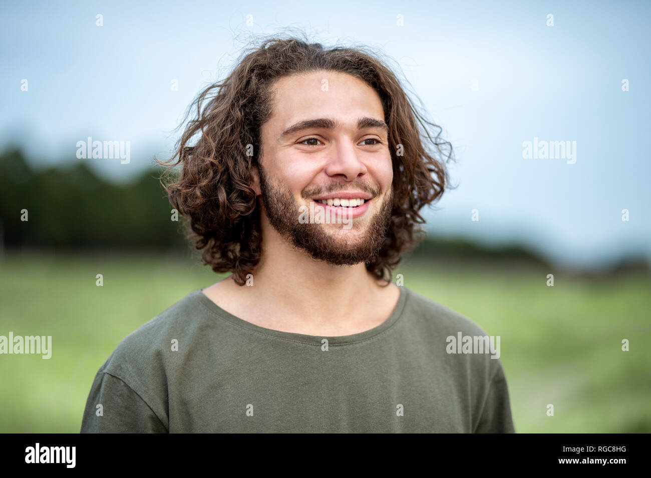 Portrait of happy young man outdoors Stock Photo