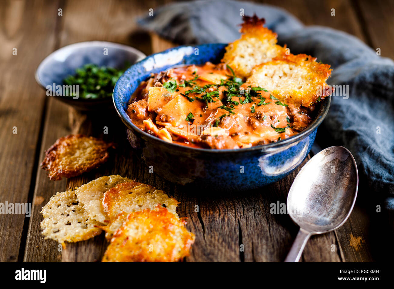 Lasagna soup, deconstructed lasagna served as soup, with parmesan crisps Stock Photo