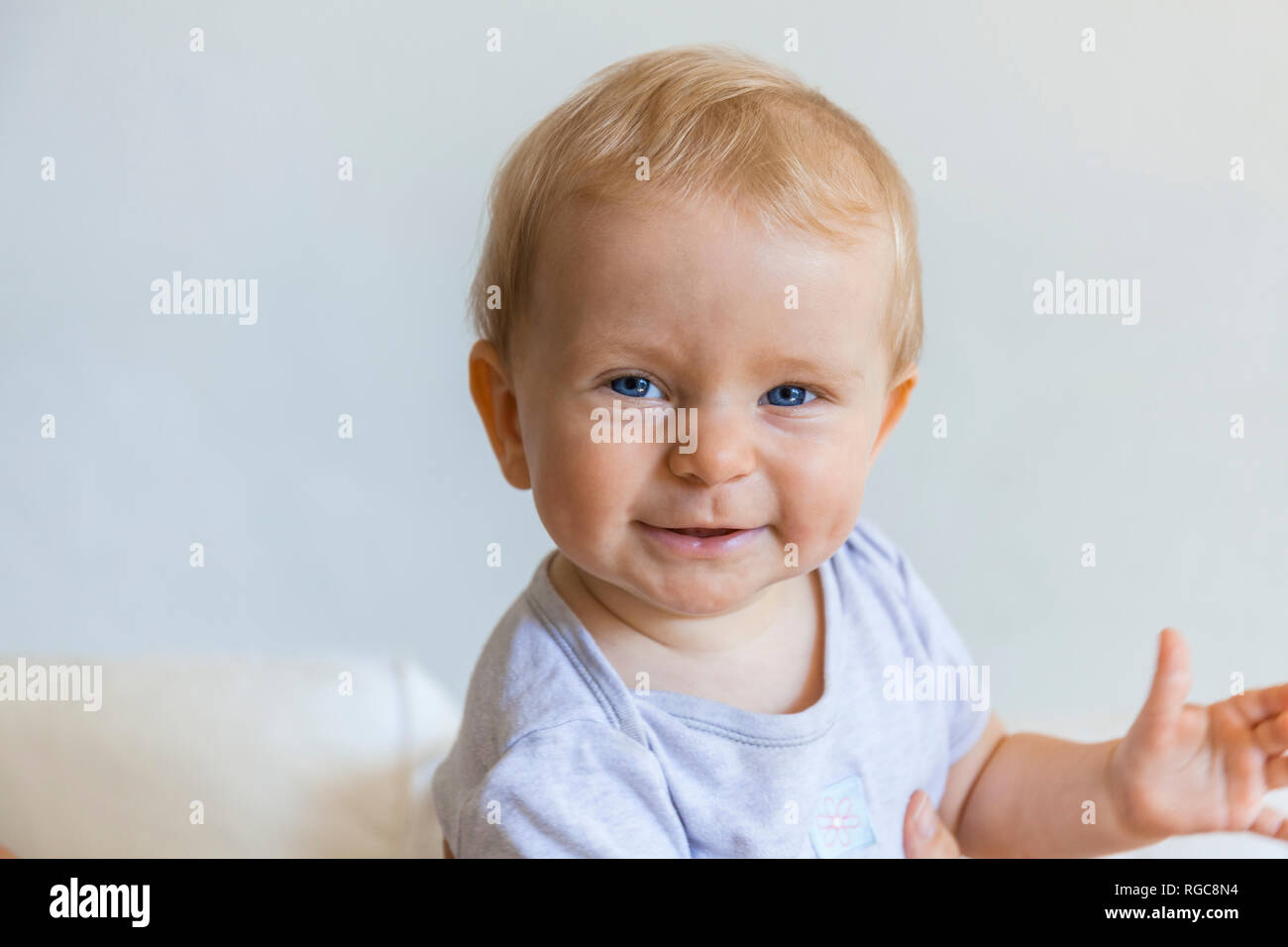 Portrait of happy blond baby girl Stock Photo
