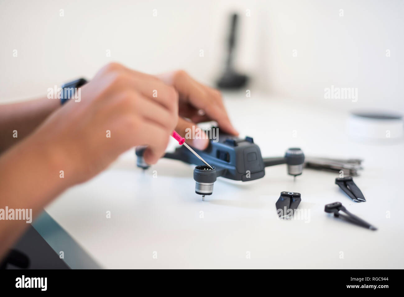 Boy repairing drone Stock Photo