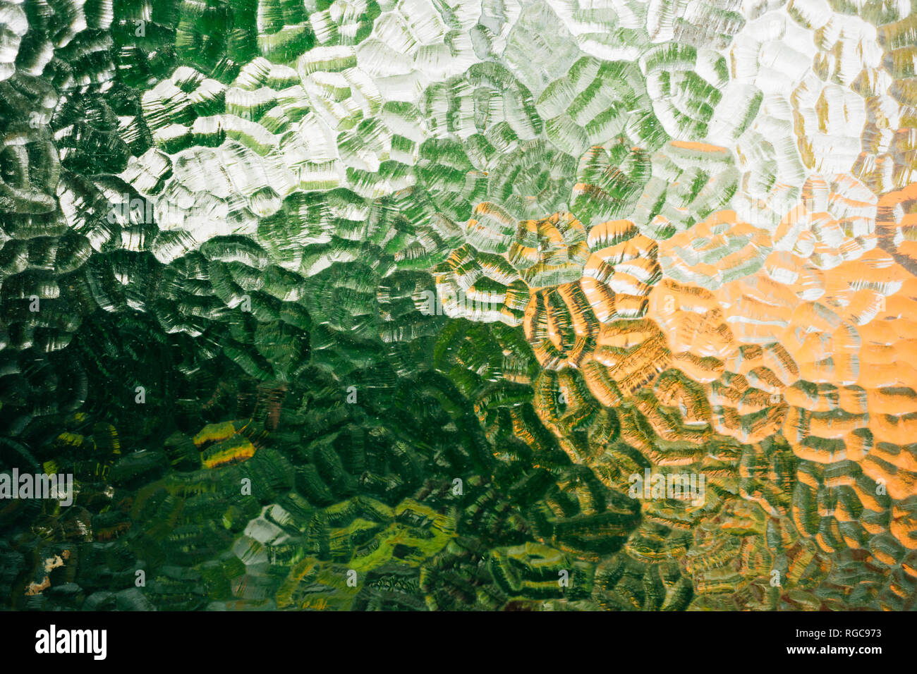 Glass window with textures and green and orange color Stock Photo