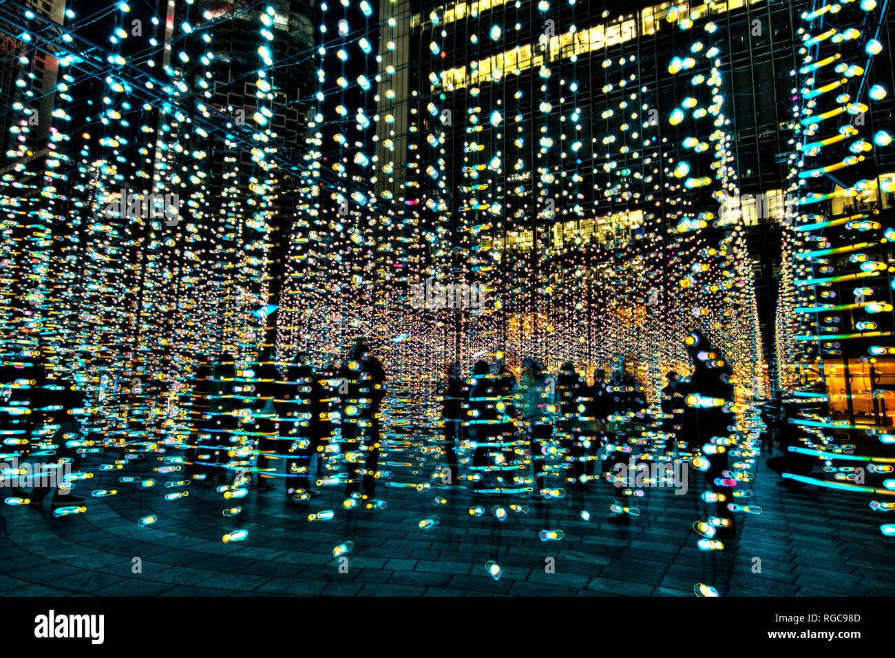 winter lights festival in Canary Wharf, light blobs display and installation, crowd visiting , digital , LED lighting, London, England Stock Photo