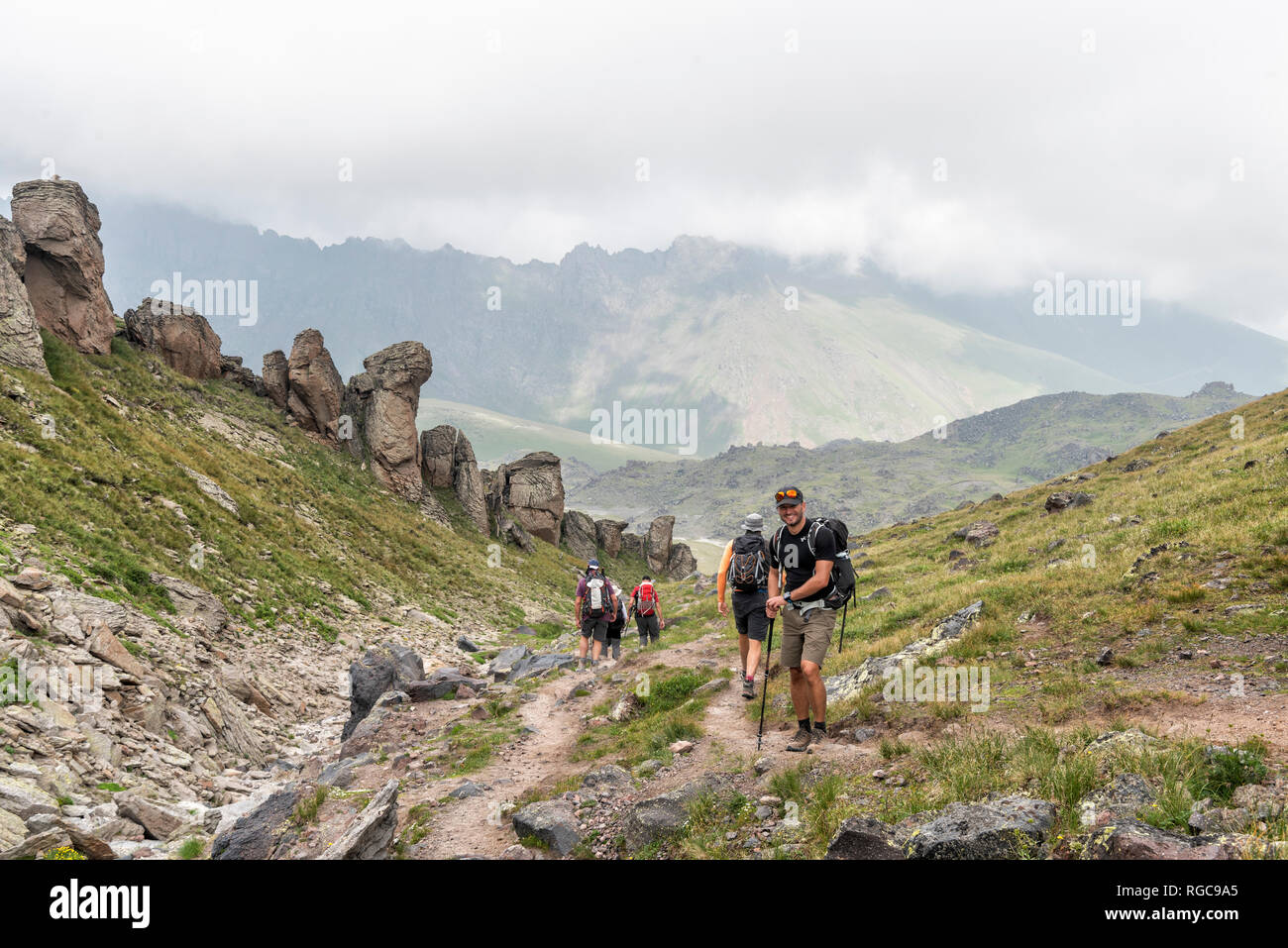 Russia, Caucasus, Mountaineers hiking in Upper Baksan Valley Stock Photo