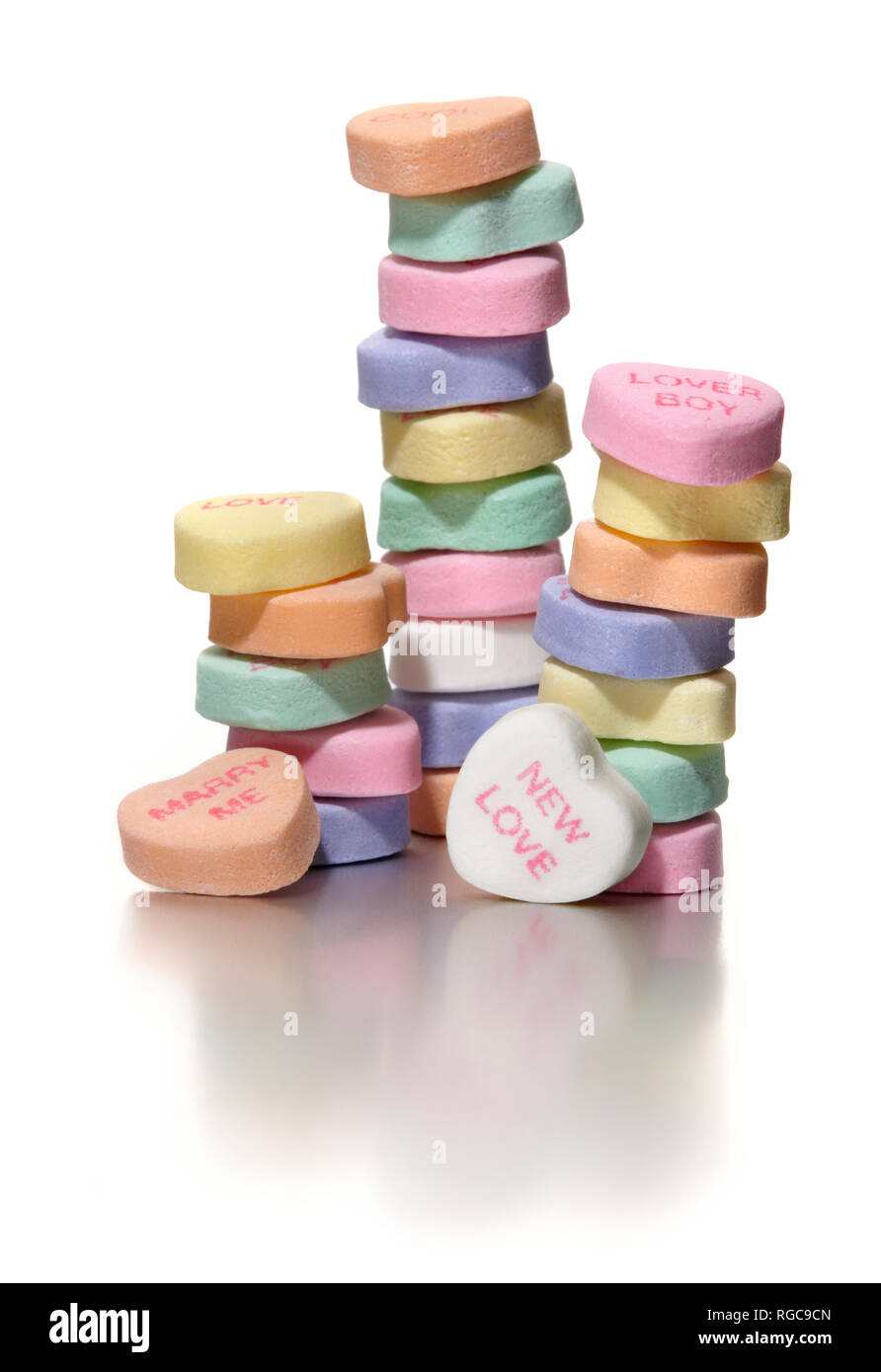 stack of sweethearts NECCO candy hearts new love photographed on a white background Stock Photo