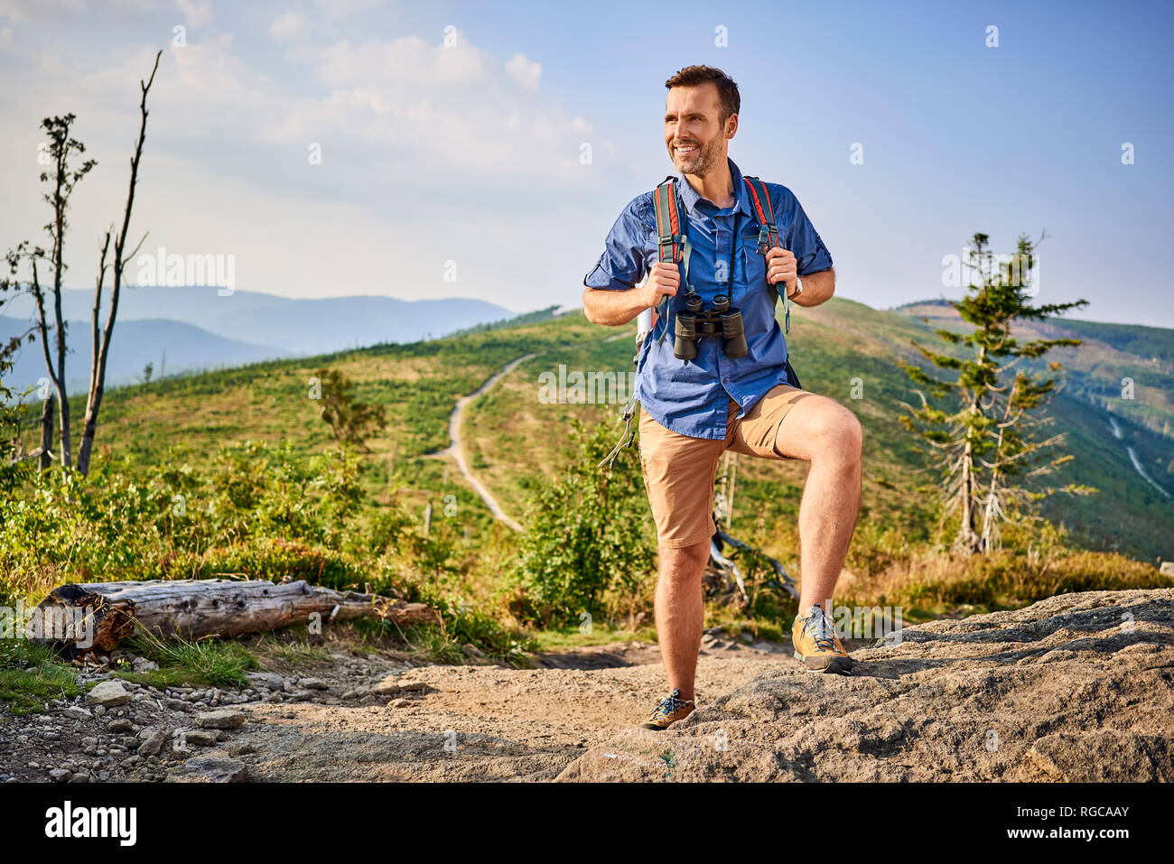 Man admiring the view during hiking trip Stock Photo