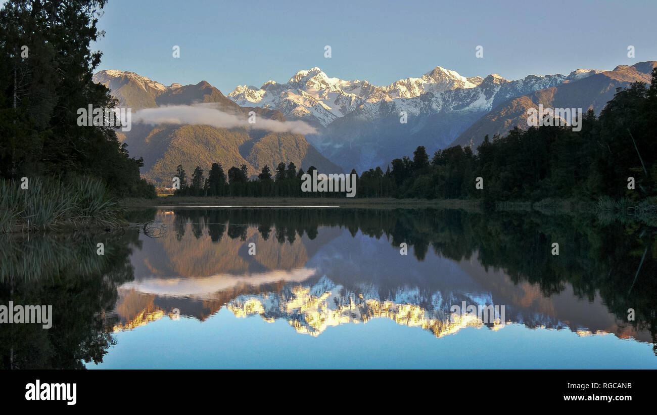 late afternoon shot of mt cook reflected in the waters of lake matheson in new zealand Stock Photo