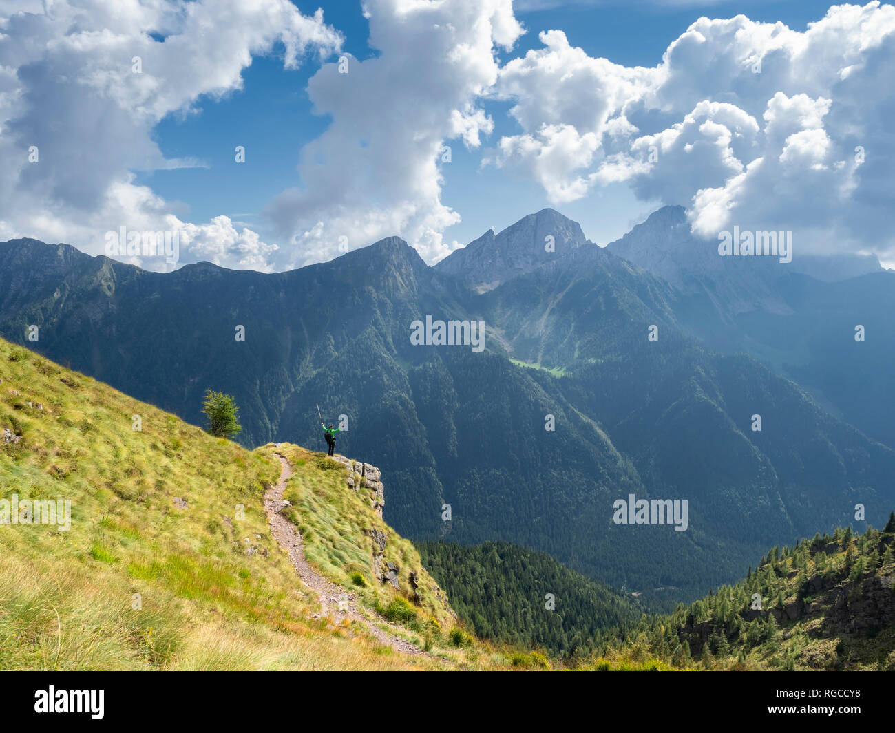 Italy, Lombardy, Valle di Scalve, hiker on hiking trail, Mount Camino Stock Photo