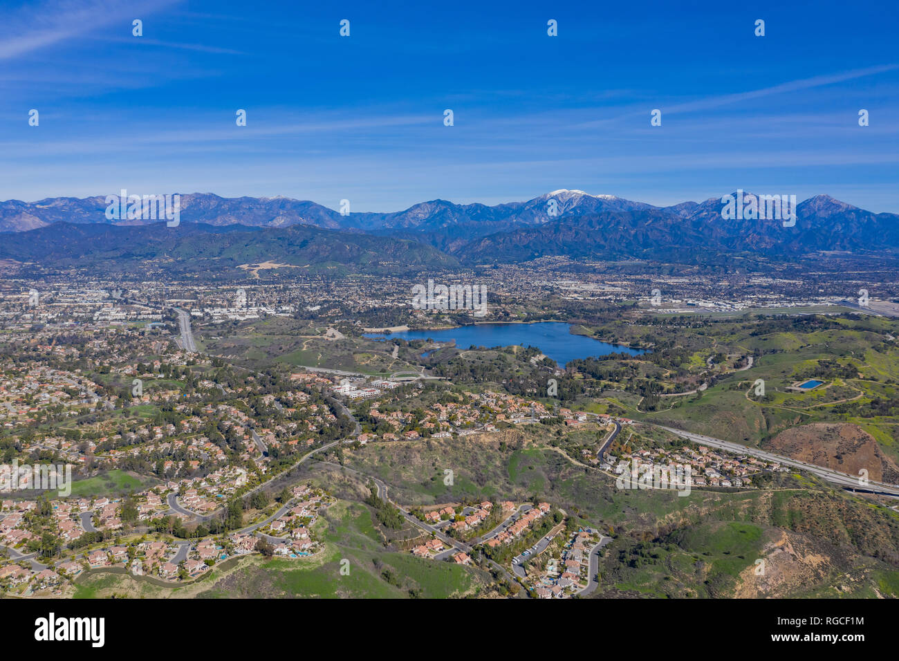 Aerial view of Puddingstone Reservoir with Mt. Baldy as background at