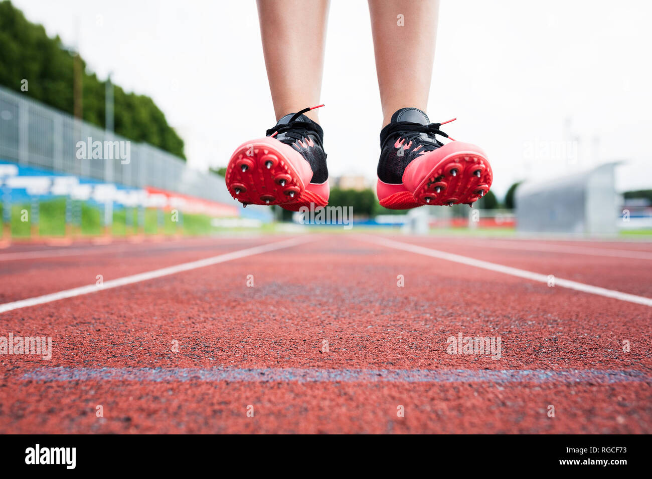 Feet of a jumping runner, mid air Stock Photo