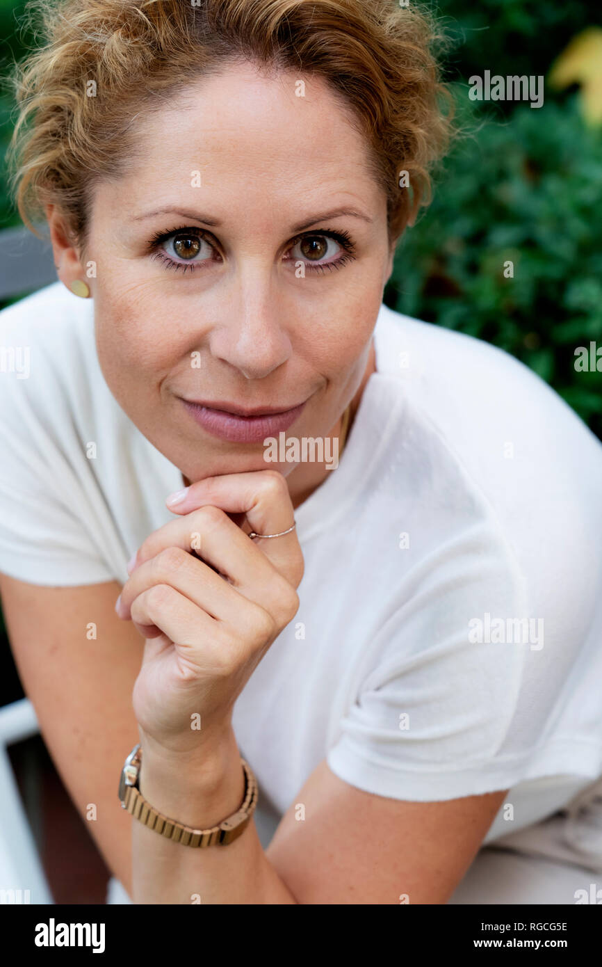 Portrait of smiling woman with brown eyes Stock Photo
