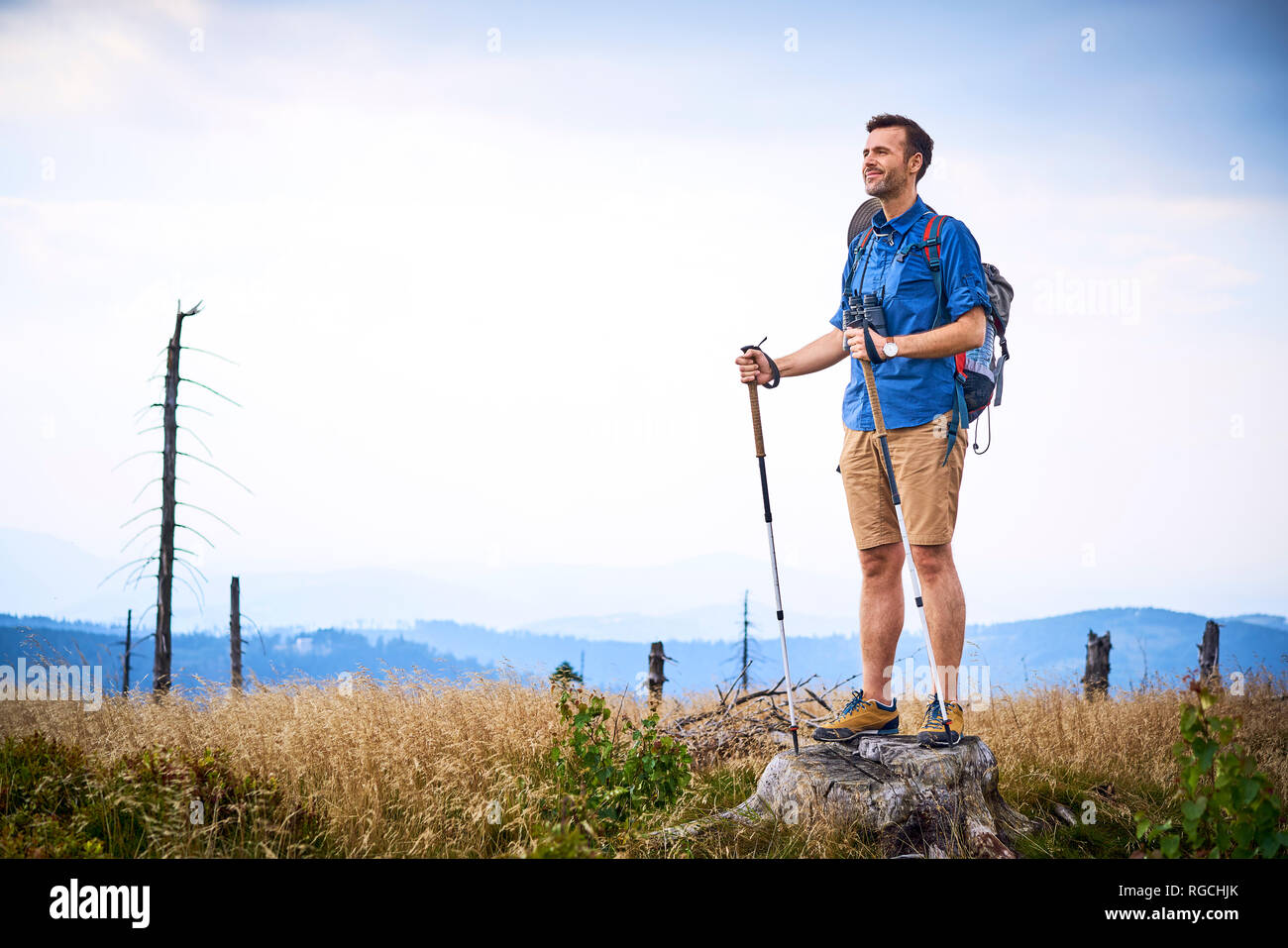 Man admiring the view during hiking trip Stock Photo