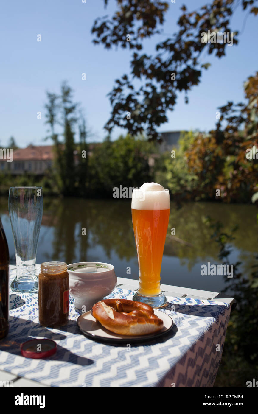 Breakfast with Bavarian veal sausage, wheat beer and pretzls Stock Photo