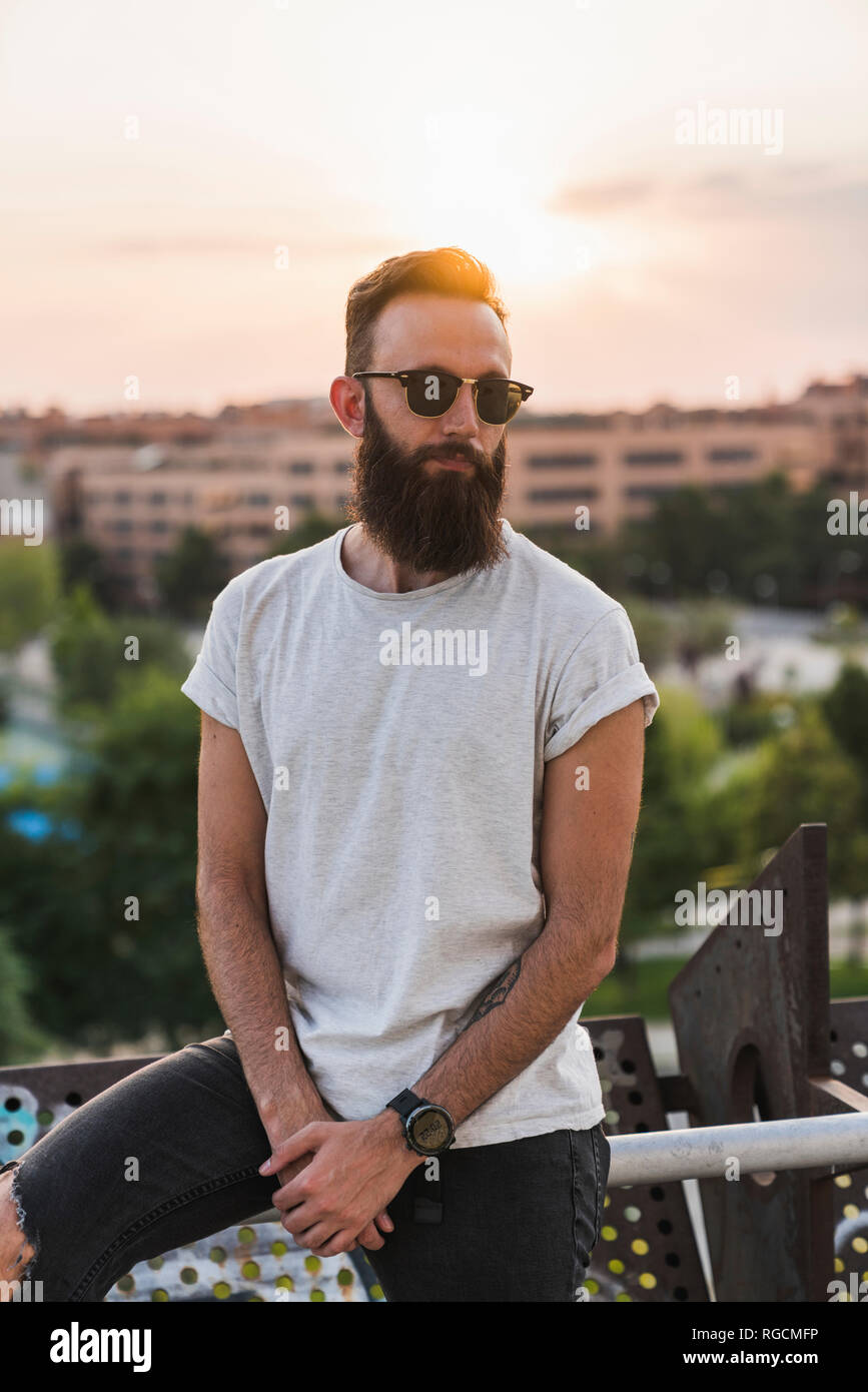 Cool bearded young man wearing sunglasses Stock Photo