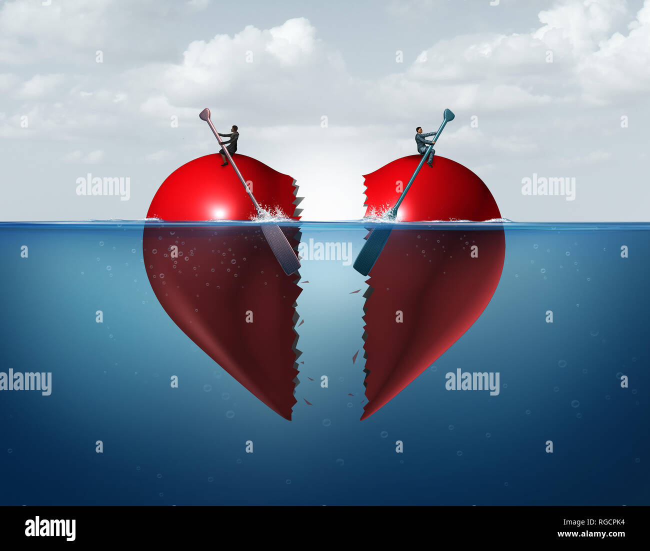 Divorce separation as a broken relationship with a couple drifting away breaking a heart apart showing the concept of a marriage dispute. Stock Photo