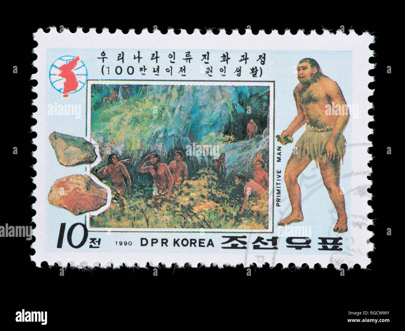 Postage stamp from North Korea depicting  primitive man and stone tools. Stock Photo