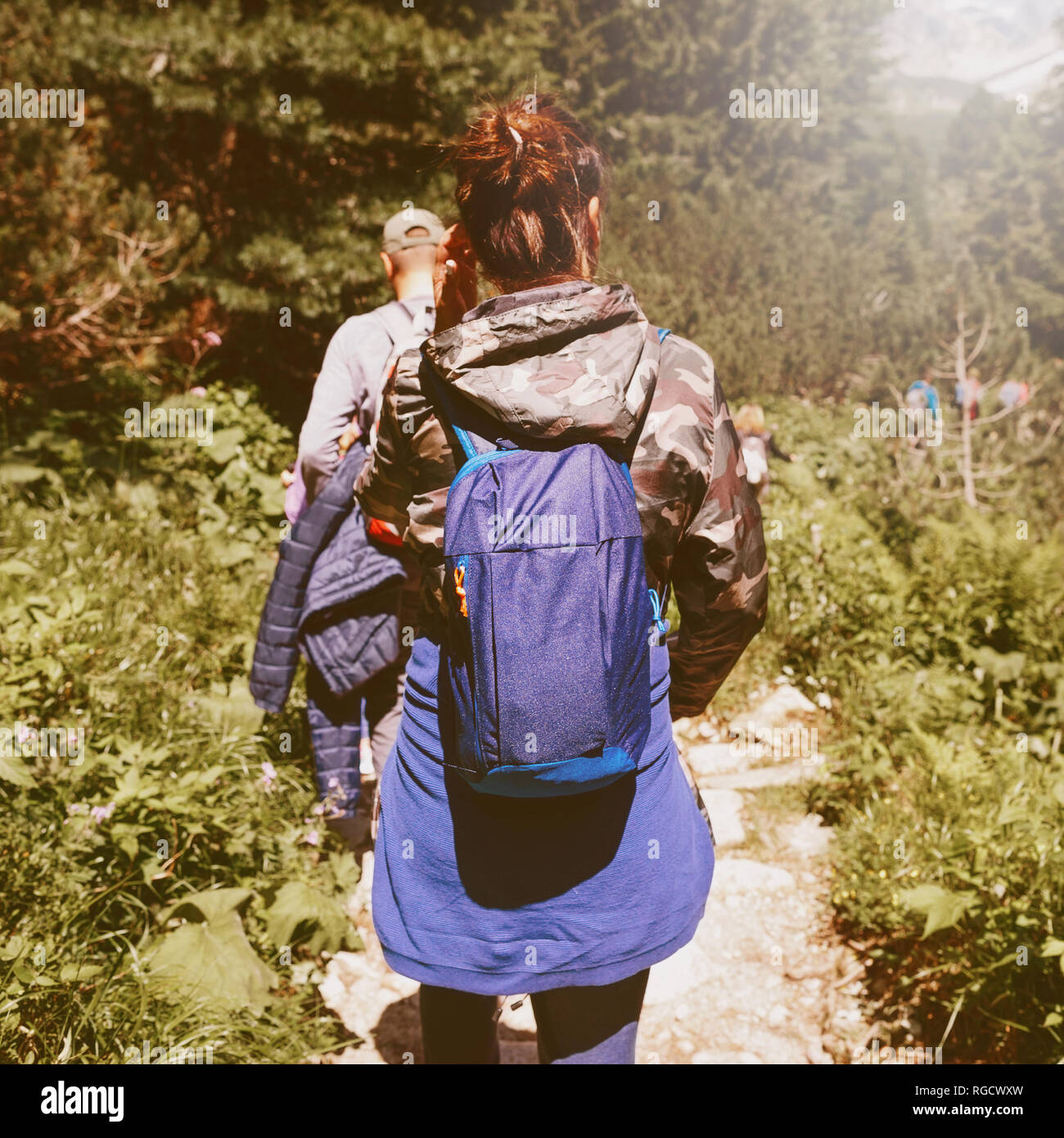 Group of traveler with backpack walking forest. Travel and backpacking lifestyle concept Stock Photo