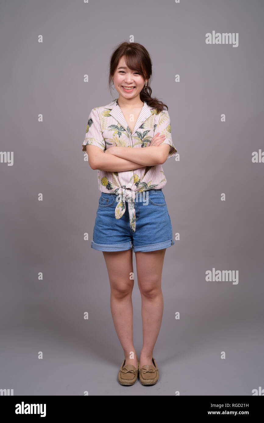 Full length portrait of beautiful young Asian woman standing Stock ...