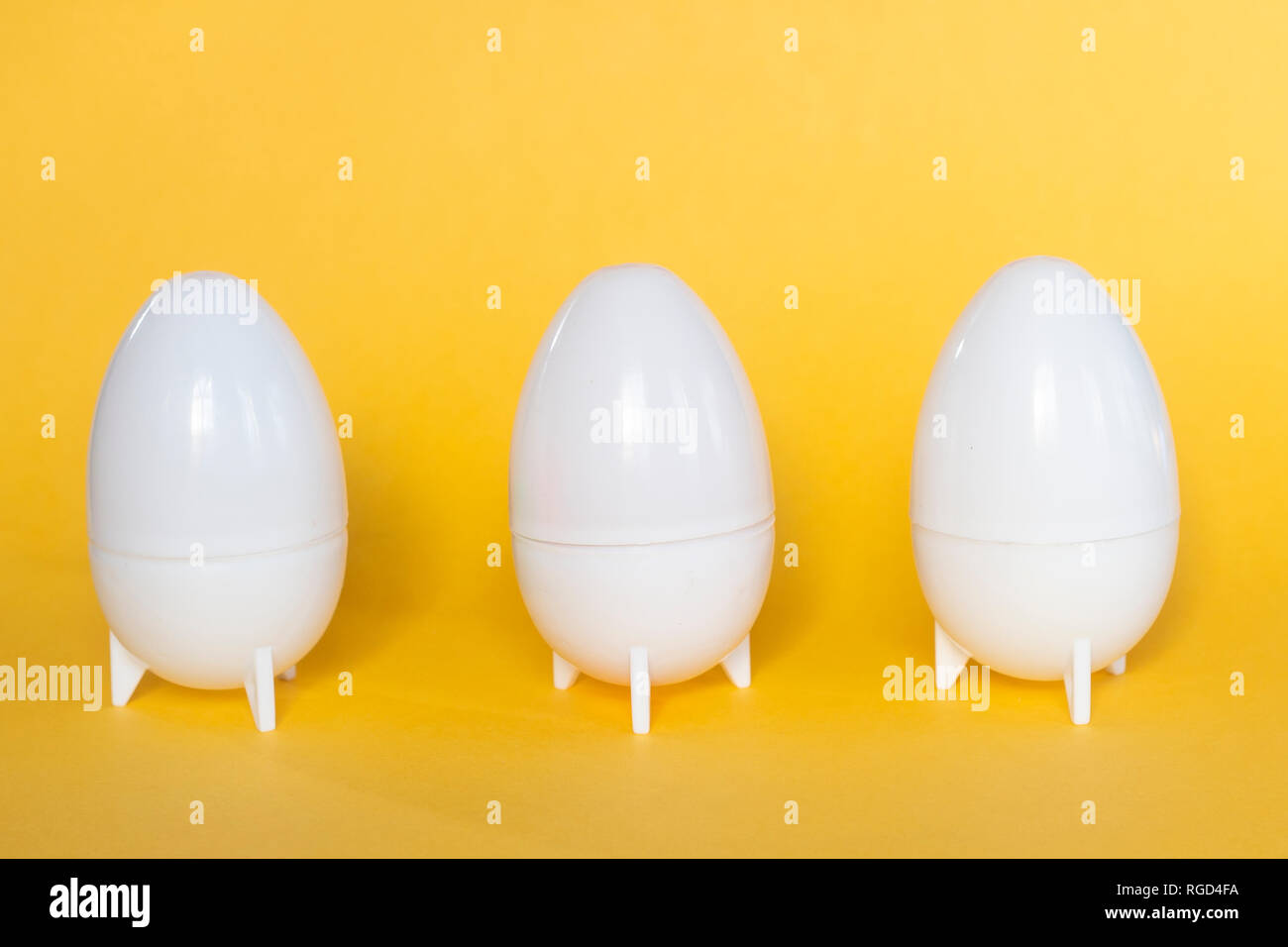 Plastic Easter Eggs on the yellow background Stock Photo