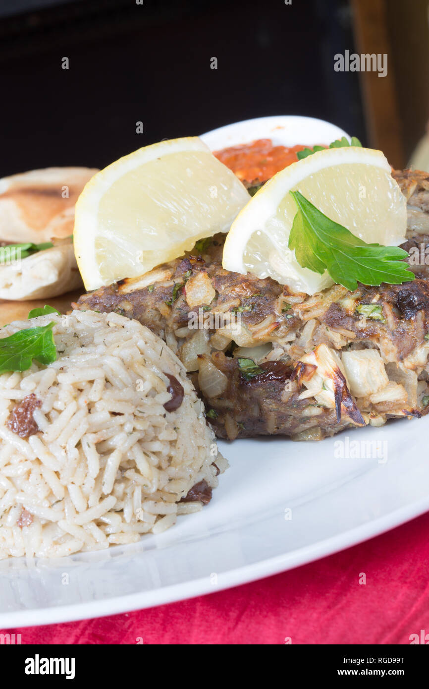 A Turkish dish of Lamb Sis Kebap, with fragrant rice, side salad and