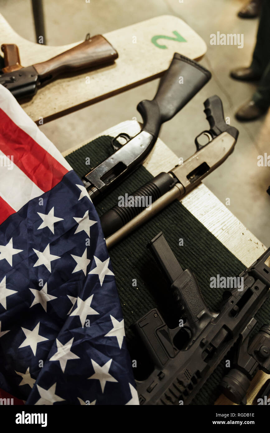 Rifles and American flag on table Stock Photo