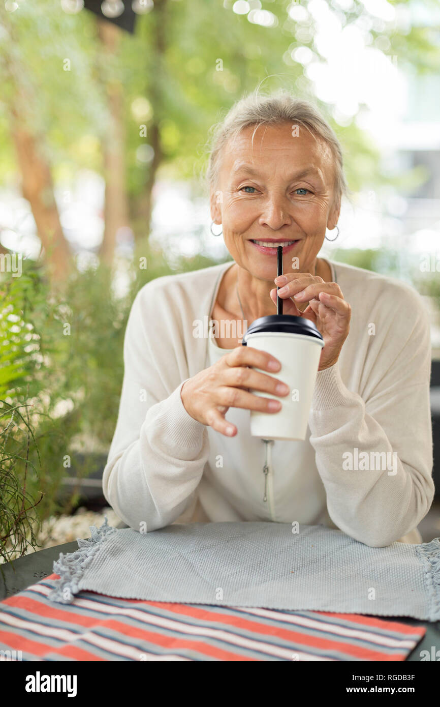 Portrait of smiling senior woman at an outdoor cafe Stock Photo - Alamy