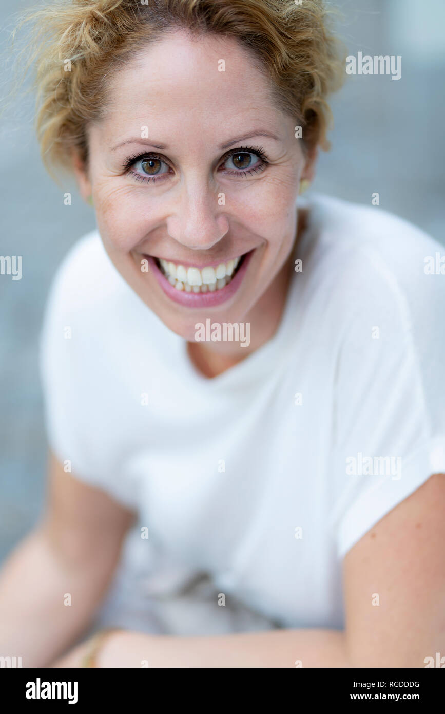 Portrait of laughing woman with brown eyes Stock Photo