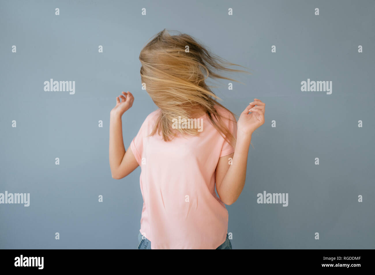 Young woman with hair covering her face Stock Photo