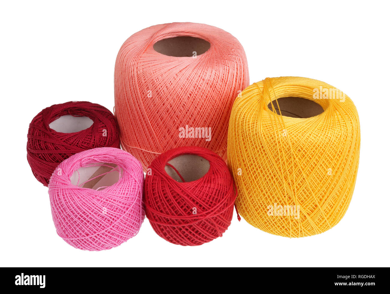 Spools of multi-colored cotton threads for homemade needlework. Isolated op  white studio closeup Stock Photo