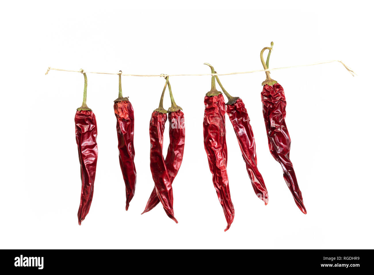 group of dried spicy chilli peppers on white background Stock Photo