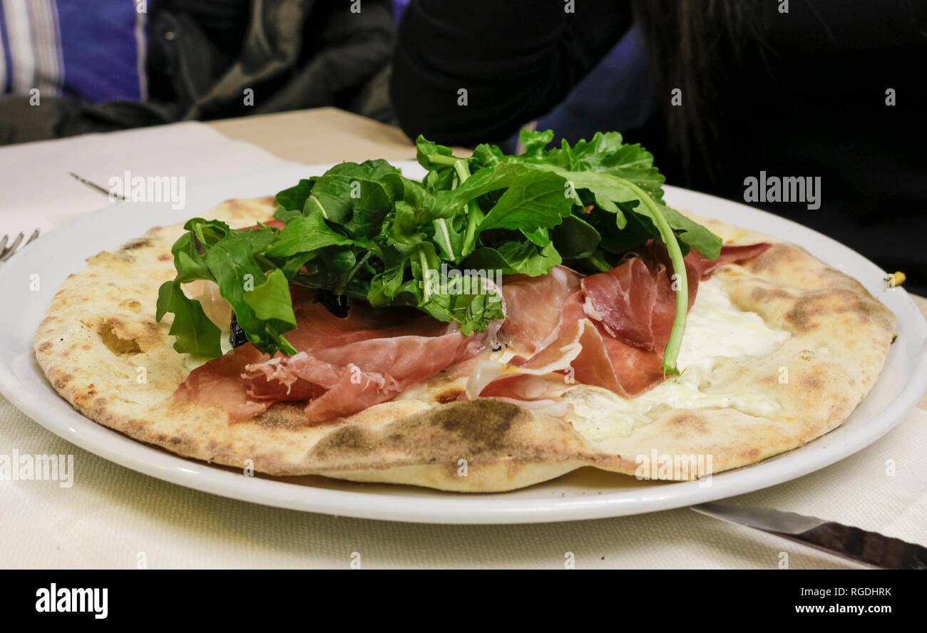 pizza with quinoa flour, raw ham and mozzarella Stock Photo