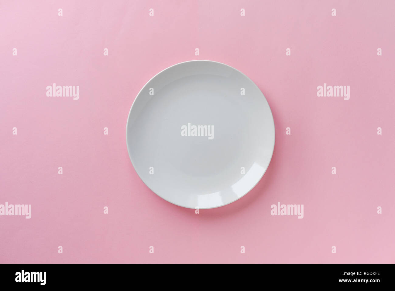 Single empty clean white ceramic plate for the serving of food on a ...