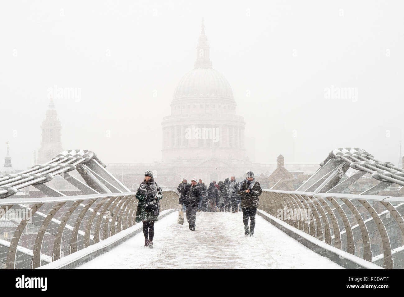 London, UK - March 1st 2018: St Paul's & the Millennium Bridge seen from the bridge in the midst of a snow storm during a sudden cold snap. Stock Photo