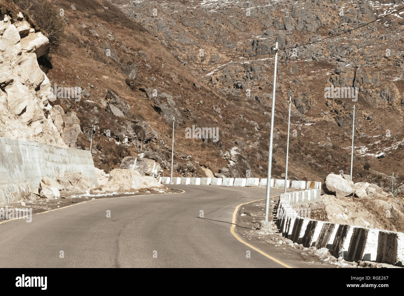 Highway road view of India China border near Nathu La mountain pass in Himalayas which connects Indian state Sikkim with China's Tibet Region, trisect Stock Photo