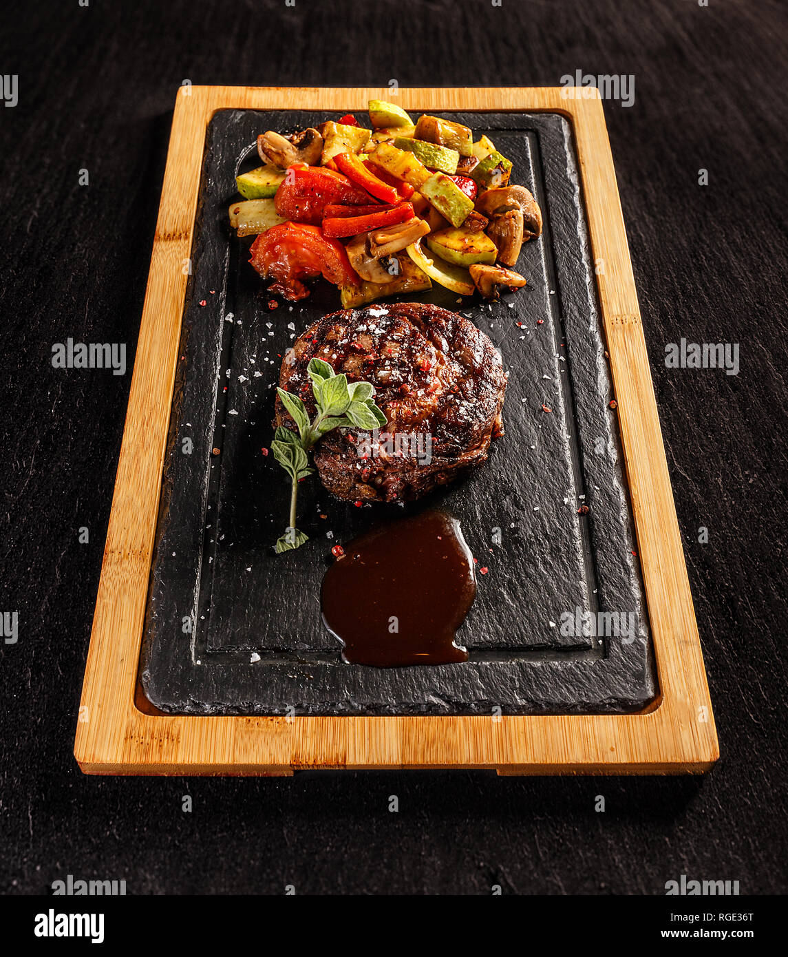 Ribeye steak with grilled vegetables and barbecue sauce Stock Photo Alamy