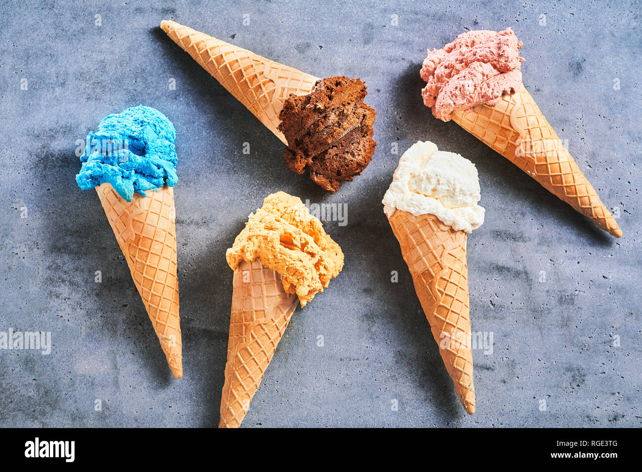 Five assorted flavors of gourmet summer ice cream served in sugar cones